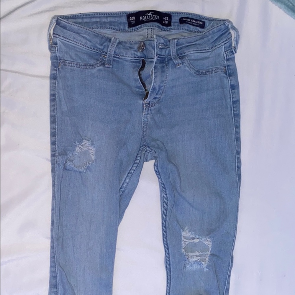 light wash jeans, have a small tear as shown